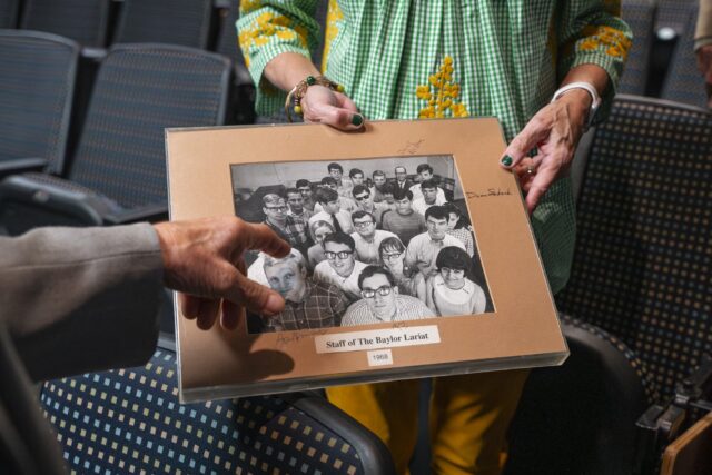 Louis Moore and his wife, Kay Moore, share a picture of The Baylor Lariat's staff from 1968. Jake Schroeder | Photographer