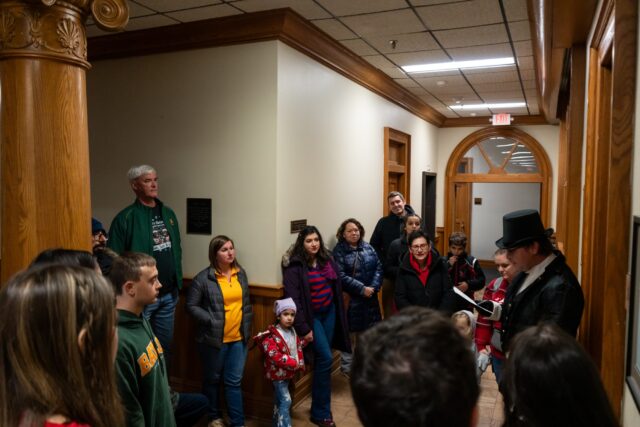 Groups of students, faculty and Baylor families gathered in Carroll Science to experience the immersive storytelling of the Christmas Carol. Alyssa Meyers | Photographer