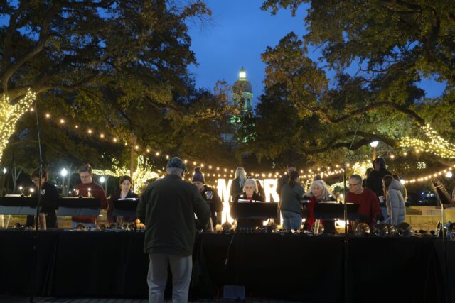 The Columbus Ave Baptist Hand-Bell Choir played a selection of Christmas carols at Vera Martin-Daniel Plaza during Baylor's Christmas on Fifth Celebration on Fountain Mall. Caleb Garcia | Photographer