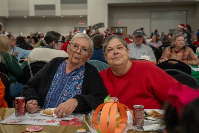 Waco locals Christine Azbell and Charlotte Latting enjoyed a free thanksgiving meal at the H-E-B Feast of Sharing on Tuesday. Sam Gassaway | Photographer