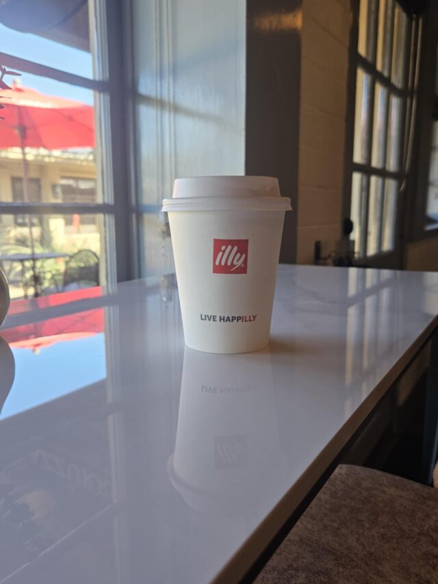 Azzurro serves a delicious hot chocolate topped with whipped cream and chocolate drizzle.