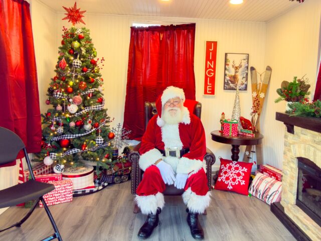 At the event, an actor dressed as Santa Claus sat in a set and posed for pictures with patrons. Jacob Stowers | Broadcast Reporter