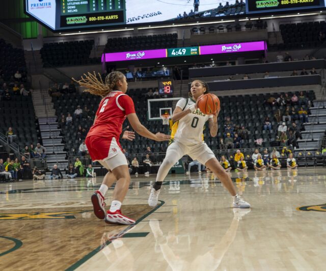 Redshirt sophomore guard Taliah Scott sidesteps a defender at the Baylor vs Houston basketball Game at Foster Pavilion on Tuesday night. Caleb Garcia | Photographer