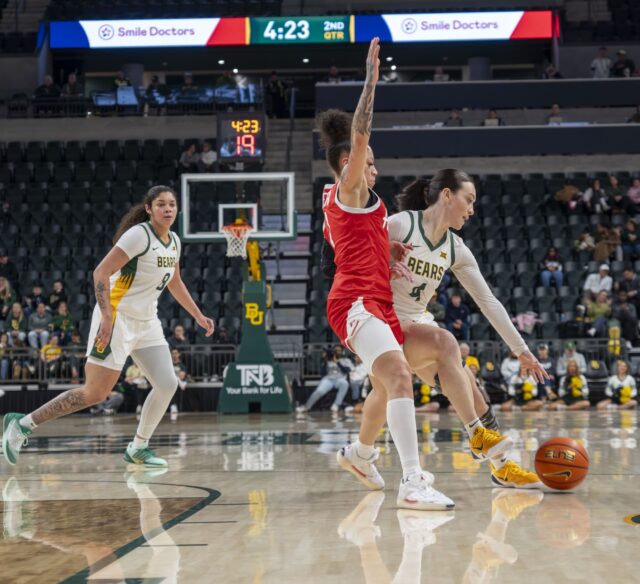 Graduate student guard Jana Van Gytenbeek slips past a defenders grasp at the Baylor vs Houston Wbasketball Game at Foster Pavilion on Tuesday night. Caleb Garcia | Photographer