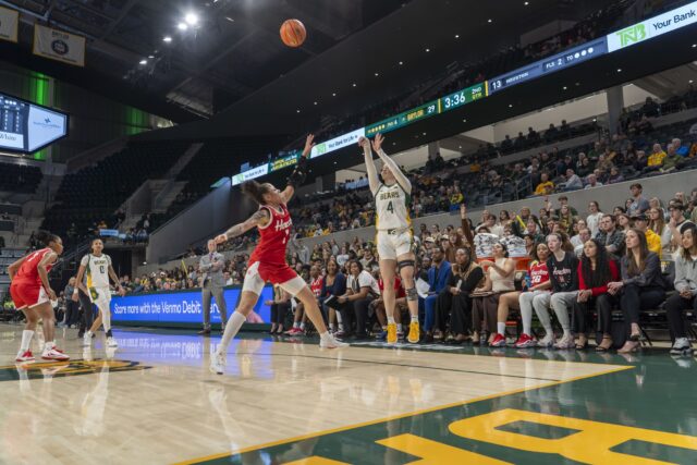 Graduate student guard Jana Van Gytenbeek jumps to shoot a three pointer at the Baylor vs Houston basketball Game at Foster Pavilion on Tuesday night. Caleb Garcia | Photographer