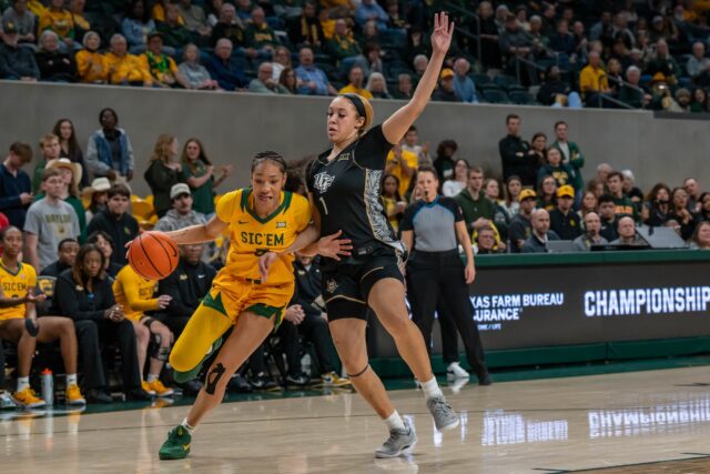 Senior guard Darianna Littlepage-Buggs dribbles past the defense