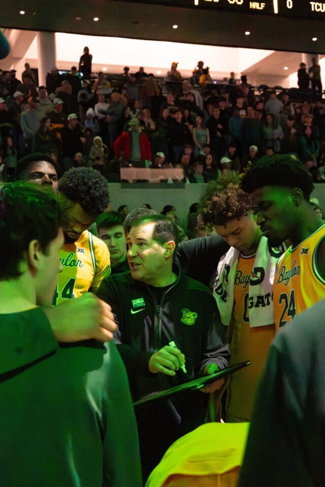 Baylor Men's Basketball head coach Scott Drew draws plays for the first possession during Baylor's lose against TCU Saturday night in Foster Pavilion. Mesha Mittanasala | Photographer