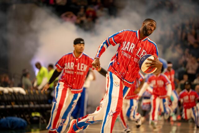 Showman Chandler "Bulldog" Mack makes a grand entrance during the Globetrotters game at Foster Pavilion on Saturday. Sam Gassaway | Photo Editor
