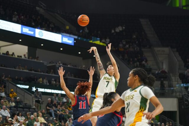 Sophomore guard Yuting Deng fires a shot over her defender during the Bears' 74-60 win on Saturday night against Arizona at Foster Pavilion. Jake Schroeder | Photographer