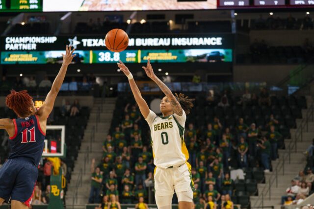 Redshirt Sophomore guard Taliah Scott fires a three over her defender during the Bears' 74-60 win on Saturday night against Arizona at Foster Pavilion. Jake Schroeder | Photographer
