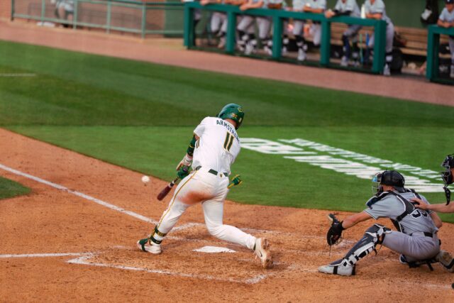 Redshirt senior first baseman Tyce Armstrong crushes a pitch to send over the left field wall for a grand slam. Brady Harris | Photographer
