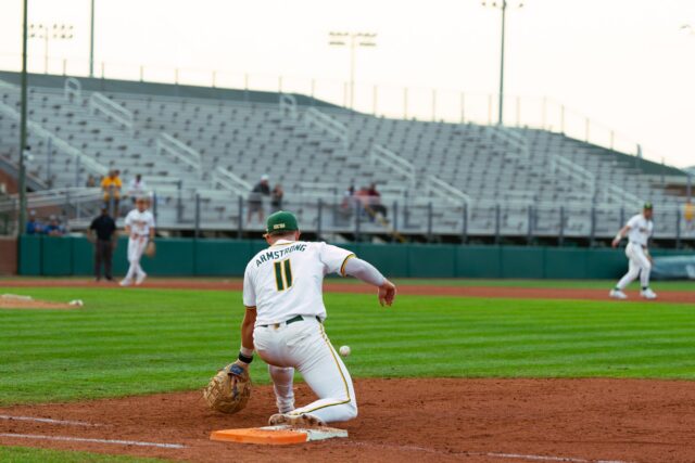 Redshirt senior first baseman Tyce Armstrong lunges forward to field a ball. Brady Harris | Photographer