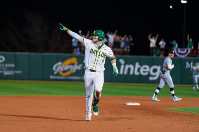 Redshirt senior first baseman Tyce Armstrong celebrates with his teammates and the fans after hitting his third grand slam of the night. Brady Harris | Photographer