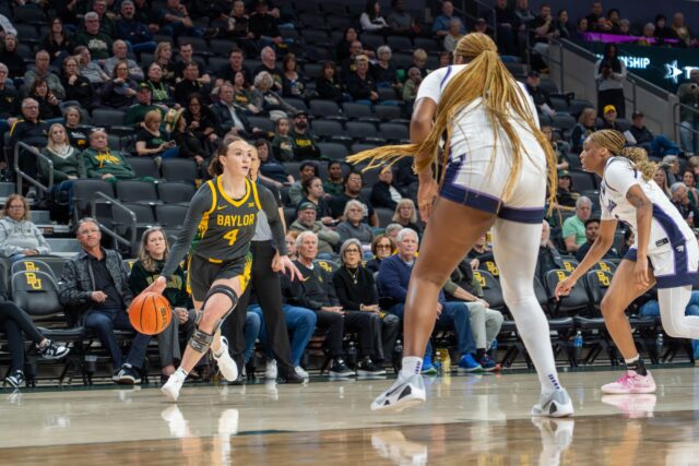 Graduate guard Jana Van Gytenbeek dribbles around defenders at the Baylor vs Kansas State Women's basketball game on Monday night at Foster Pavilion. Caleb Garcia | Photographer