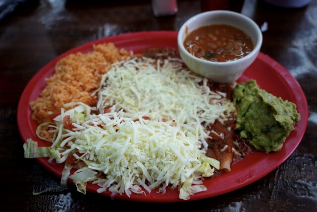 The cheese enchilada, comes with rice, beans, guacamole, and a hearty serving of cheese on top. Sophia Monson | Social Media Editor