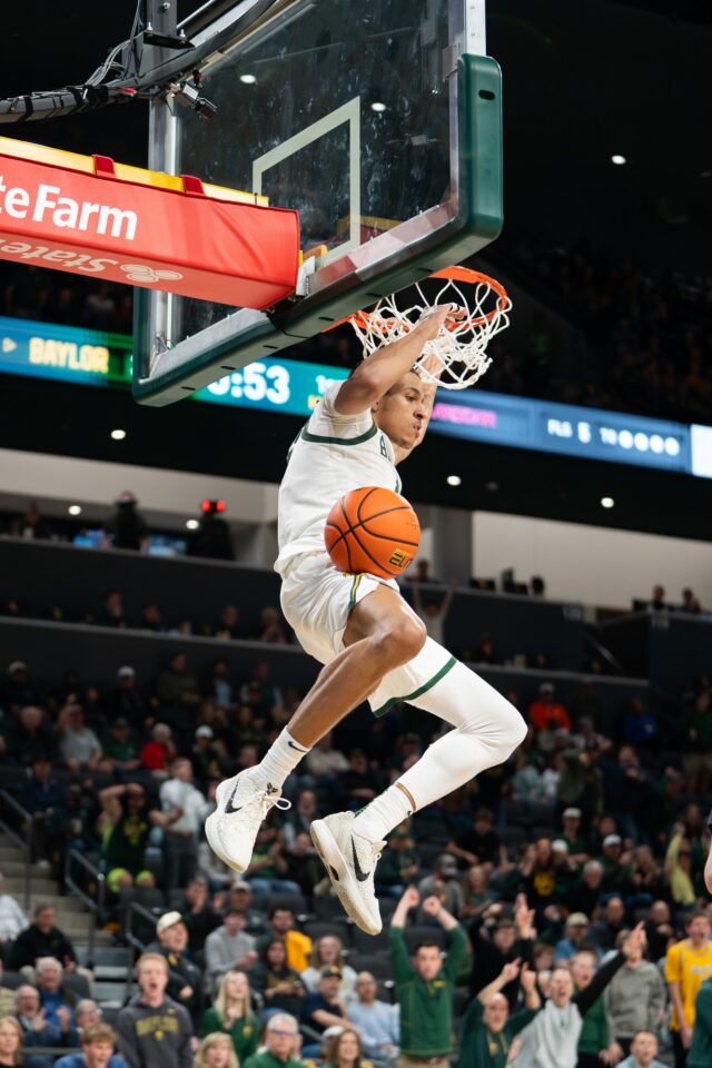 Redshirt sophomore Cameron Carr slams home a dunk during Baylor's 87-80 loss to Arizona on Tuesday night. Abby John | Roundup Photo Editor
