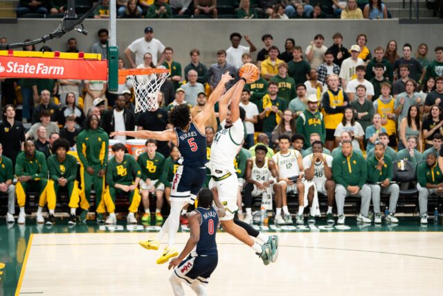 Senior center Caden Powell slams home a dunk during Baylor's 87-80 loss to Arizona on Tuesday night. Abby John | Roundup Photo Editor