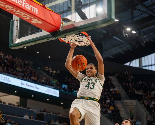 Redshirt sophmore Cameron Carr flushes a dunk during No. 14 Baylor Men’s Basketball’s win 73-68 against Arizona State Saturday afternoon at Foster Pavilion. Mesha Mittanasala | Photographer