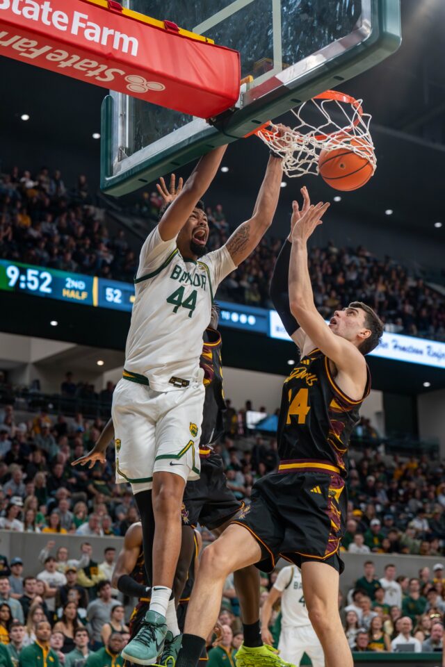 Senior center Caden Powell dunks on the defense during No. 14 Baylor Men’s Basketball’s win 73-68 against Arizona State Saturday afternoon at Foster Pavilion. Mesha Mittanasala | Photographer