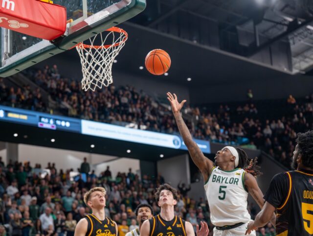 5th year guard Obi Agbim puts up a layup during the final seconds of the game during No. 14 Baylor Men’s Basketball’s win 73-68 against Arizona State Saturday afternoon at Foster Pavilion. Mesha Mittanasala | Photographer