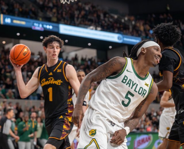 5th year guard Obi Agbim smiles at the crowd after sinking a layup during No. 14 Baylor Men’s Basketball’s win 73-68 against Arizona State Saturday afternoon at Foster Pavilion. Mesha Mittanasala | Photographer