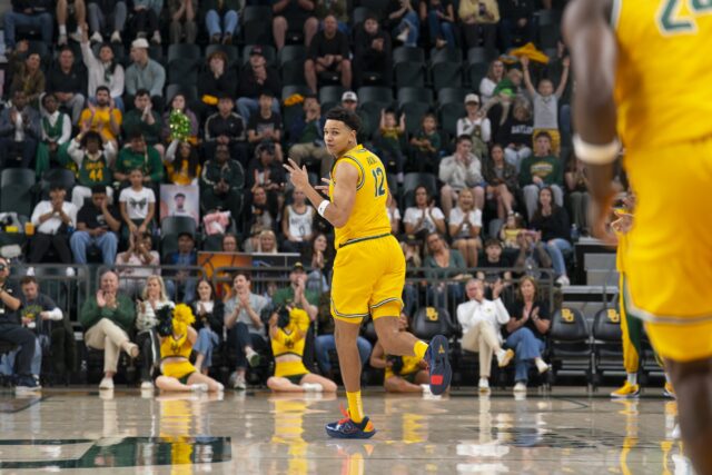 Senior guard Michael Rataj celebrates after sinking a three-pointer. Jake Schroeder | Photographer