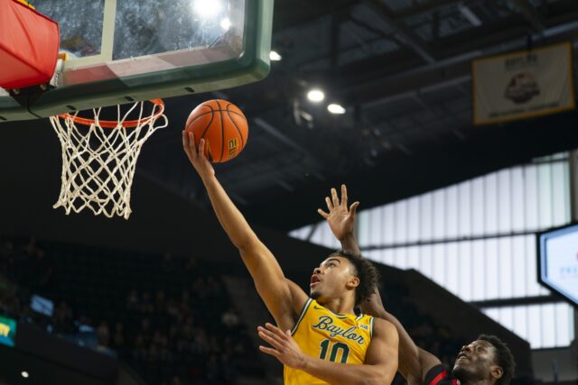 Sophomore guard Isaac Williams IV slips in for a layup. Jake Schroeder | Photographer