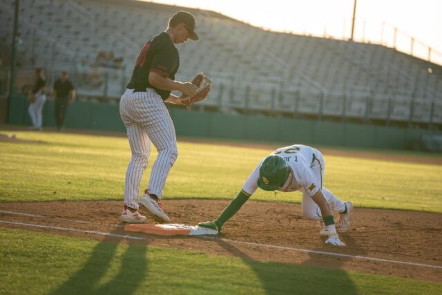 Fifth year outfielder Ty Johnson stays safe of first base during the Bears' .... victory over UIW at the Baylor Ballpark on Tuesday. Sam Gassaway | Photo Editor