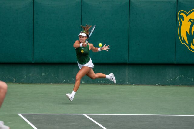 Junior Zuzanna Kubacha returns a tough hit. Brady Harris | Photographer