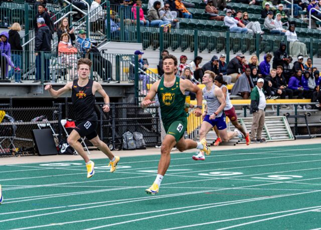 Freshman hurdler Werner Bezuindenhout takes the lead after a round of hurdles at the  Clyde Hart Track and Field Stadium on Saturday morning. Caleb Garcia | Photographer