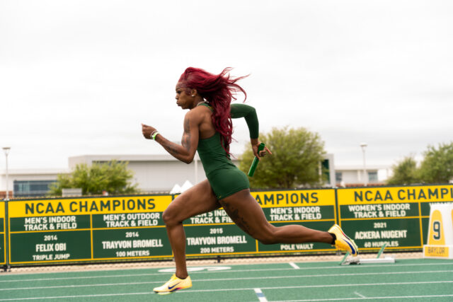 Sophomore sprinter Royaltee Brown takes off with the baton during the Relay event at the  Clyde Hart Track and Field Stadium on Saturday morning. Caleb Garcia | Photographer