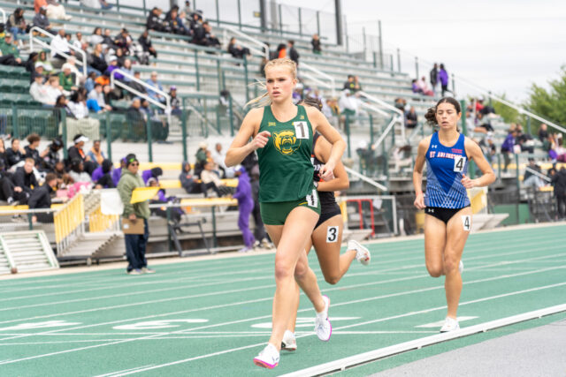 Freshman distance runner Evanna Jacobsen takes the lead during the steeple chase event at the Clyde Hart Track and Field Stadium on Saturday morning. Caleb Garcia | Photographer
