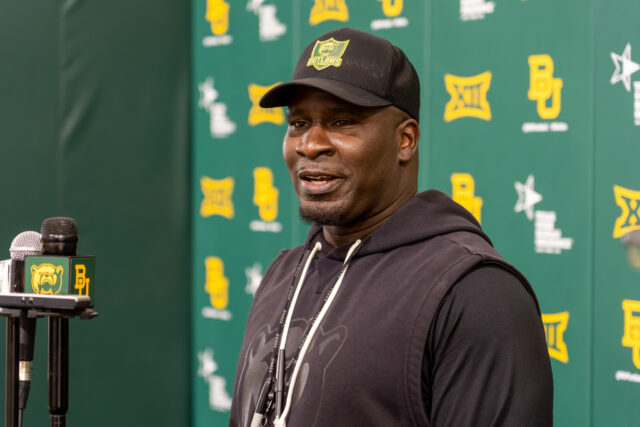 Associate Head Coach Khenon Hall speaks on his experiences as a team member at the Allison Indoor Practice Facility on Tuesday evening. Caleb Garcia | Photographer