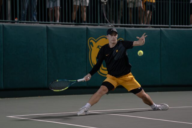 Junior Louis Bowden returns a forehand during the Bears' 4-2 win against Ohio State Thursday night at the Hurd Tennis Center. Alyssa Meyers | Photographer