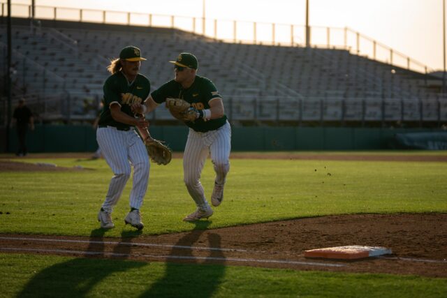 Redshirt freshman pitcher Cayden Baker and redshirt senior first baseman Tyce Armstrong collide during the Bears’ 5-1 loss against Tarleton State on Tuesday. Sam Gassaway | Photo Editor