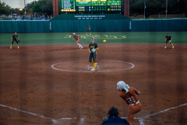 Sophomore pitcher Cambree Creager pitches down the middle allowing a hit from the Longhorns during Saturday's matchup. Rory Dulock | Copy Editor