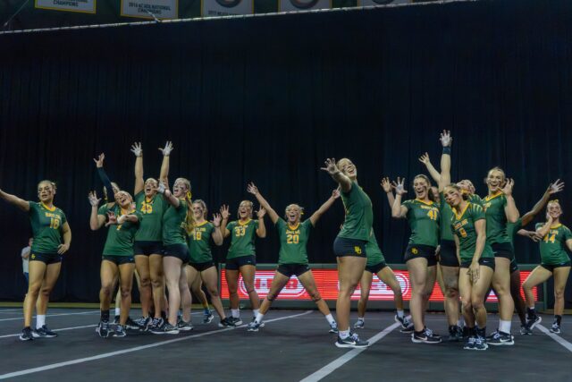 Baylor Acro and Tumbling end their routine with a sic'em during their meet against University of Oregon at Foster Pavillion saturday evening. Mesha Mittanasala | Photographer