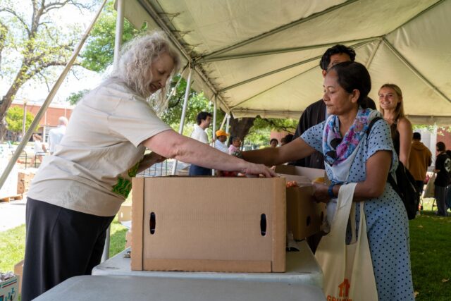 Fountain Mall was filled with tents and food while busy students waited in line as volunteers helped guide them through the plentiful stalls at the semesterly Free Farmers Market. Sam Gassaway | Photo Editor