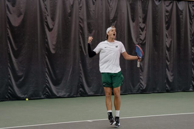 Junior Connor Van Schalkwyk celebrates after winning a point during the Bears' match against 
TCU Sunday afternoon at Hawkins Indoor Tennis Center. Alyssa Meyers | Photographer
