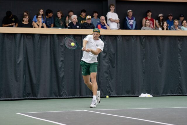 Senior Zsombor Velcz returns a backhand during the Bears' match versus TCU Sunday afternoon at Hawkins Indoor Tennis Center. Alyssa Meyers | Photographer