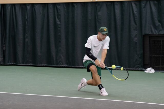 Junior Louis Bowden hits a backhand during the Bears' 1-4 loss against TCU Sunday afternoon at Hawkins Indoor Tennis Center. Alyssa Meyers | Photographer