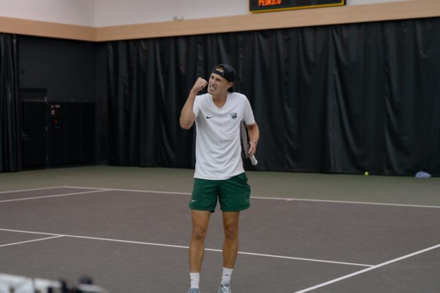 Senior Luc Koenig celebrates after winning a point during the Bears' match against 
TCU Sunday afternoon at Hawkins Indoor Tennis Center. Alyssa Meyers | Photographer