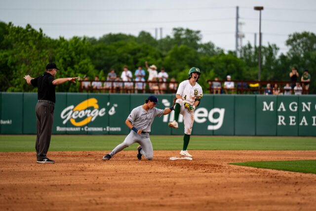 Junior catcher JJ Kennett celebrates on second base during Baylor's 10-9 extra-innings win over UTSA Tuesday night. Sam Gassaway | Photo Editor