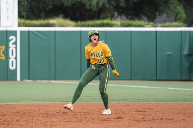 Freshman third baseman Kaygen Marshall celebrates while rounding the bases after her two-run homer, which brought the game to 6-2 with the Aggies leading at the bottom of the 1st. Jake Schroeder | Photographer