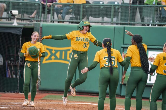 Freshman third baseman Kaygen Marshall celebrates after rounding the bases for her seventh home run of the year. Jake Schroeder | Photographer