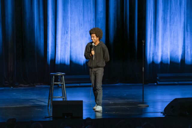 Caleb Elliott, a comedian, writer, and actor from North Carolina, who is currently touring with John Crist, warms up the crowd during his set before Crist takes the stage. Jake Schroeder | Photographer