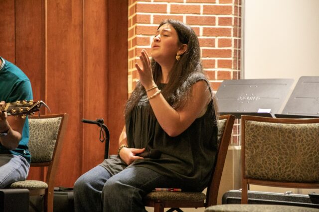 League City senior Moriah Aragon sings worship songs during "Awake" Friday night at Elliston Chapel. Hannah Webb | Opinion Editor