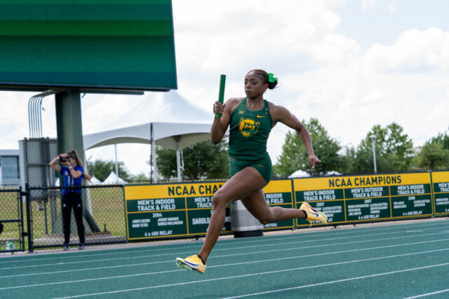 Senior sprinter Tiriah Kelley takes the lead during a relay at the Baylor Invitational track meet at Clyde Hart Track and Field Stadium on Friday afternoon. Caleb Garcia | Photographer