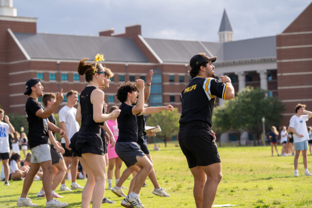 Players cheer on a successful home run at the Kicks for Casa fundraiser event at the Baylor Softball Fields on Saturday evening. Caleb Garcia | Photographer