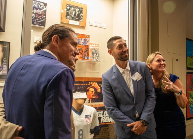 Hall of fame inductee and soccer legend Clint Dempsey smiles with his family in front of his career regalia at the Texas Sports Hall of Fame. Marissa Essenburg | Sports Writer